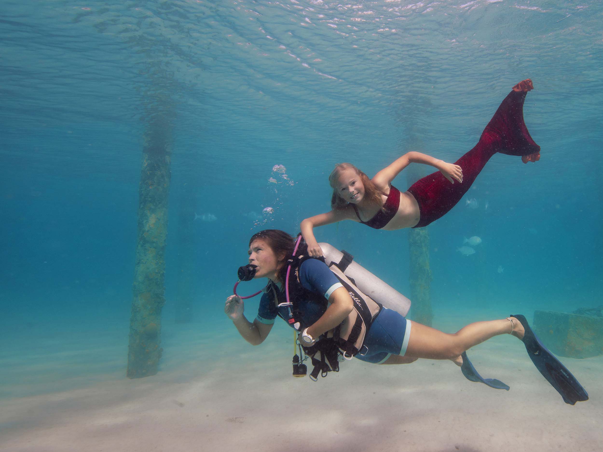 mermaid underwater photoshoot bonaire. mother and daughter