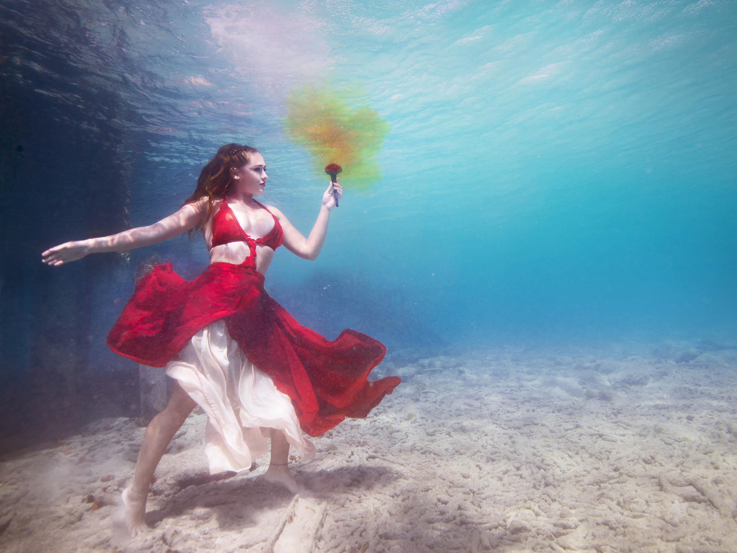 girl in beautiful dress for an underwater photoshoot